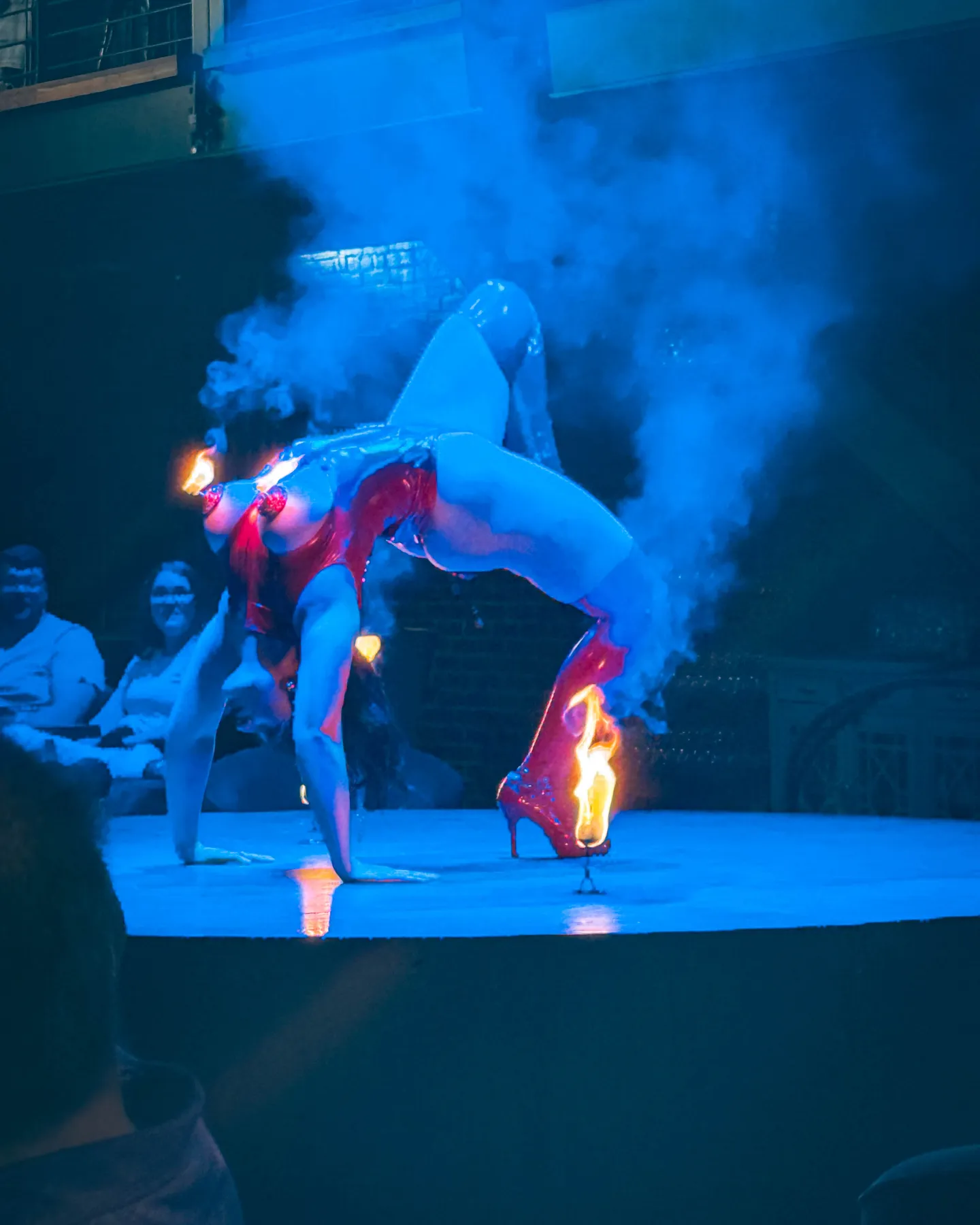 A performer in a dazzling outfit during the show at Fabrika.