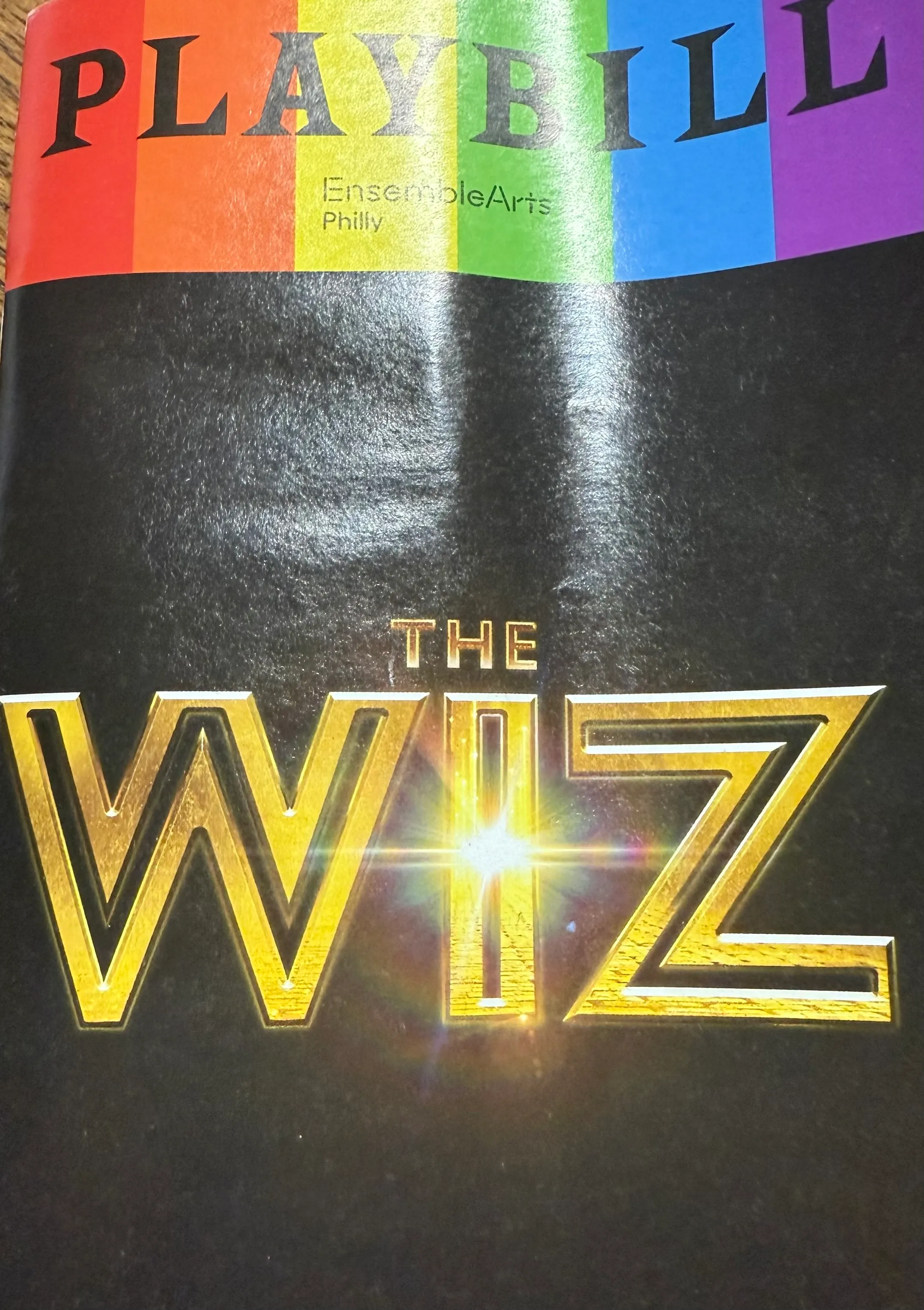 The magical finale of The Wiz - climactic scene showing the full cast on stage in elaborate costumes during the triumphant conclusion of the musical, with dramatic lighting illuminating the Academy of Music theater